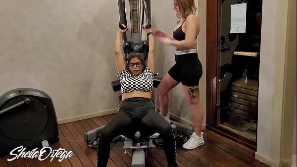 Lesbians get hot in the gym and go to the bathroom to fuck videos