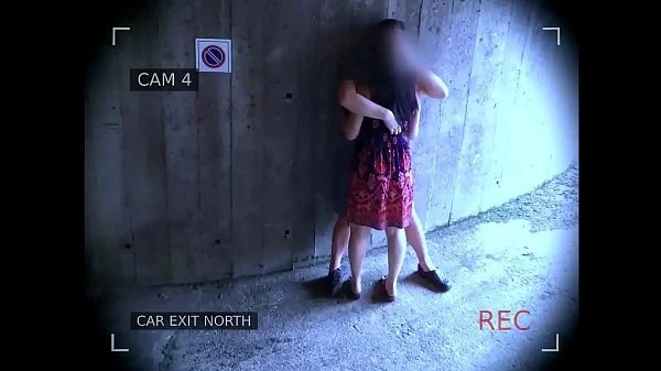 Young couple fucks in front of the garage exit and is caught by the surveillance camera videos