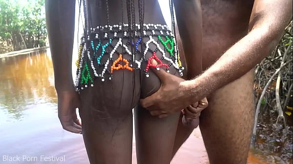 Journalist came to film an African tribe ended up getting his cock ridden by a horny ebony village girl in the water videos