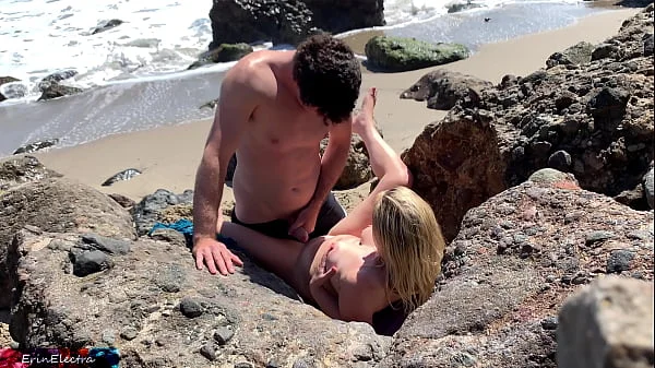 Voluptuous blonde sunbathing nude on the beach fucks passer-by - Erin Electra videos