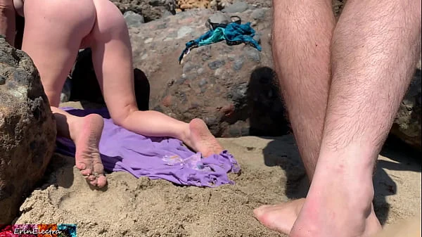 Voluptuous blonde sunbathing nude on the beach fucks passer-by - Erin Electra videos