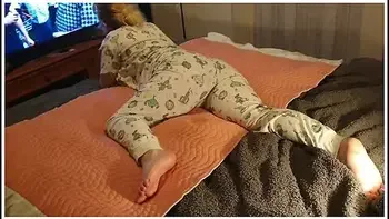 Cute Lazy Girl Wets Her Pyjamas Watching Tv Lying On Her Tummy! videos