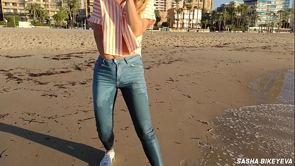 Wet shoot on a public beach with Crazy Model. Risky outdoor masturbation. Foot fetish. Pee in jeans. videos