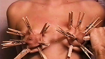 Horny dude loves putting clothes pegs on his slaves tits videos
