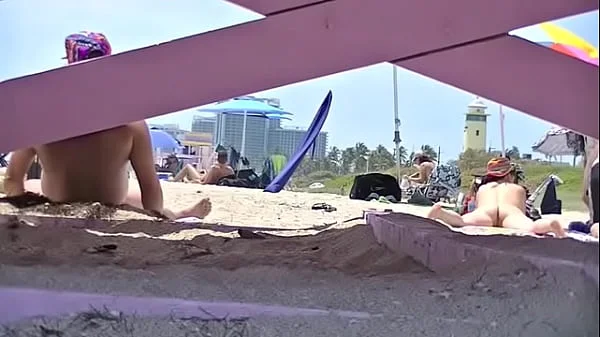 Exhibitionist Wife 63 - Tatiana teasing NUDE BEACH VOYEUR cocks while her hubby takes a nap! videos