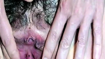 German MILF fingers her hairy pussy at home videos