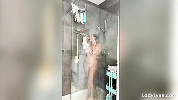 Showering chick Lady Lyne is touching her pussy in the morning videos