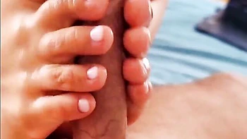 Good close-up footjob session with a long-legged girlfriend videos