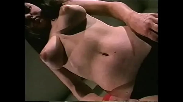 Vintage babe caresses her huge hard nipples in 70s retro movie videos