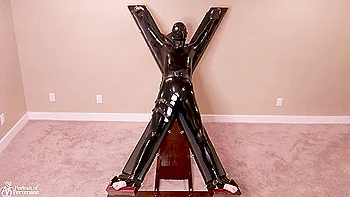 Latex Servitude Floozy Is Made To Have Multiple Orgasms On A Cross videos