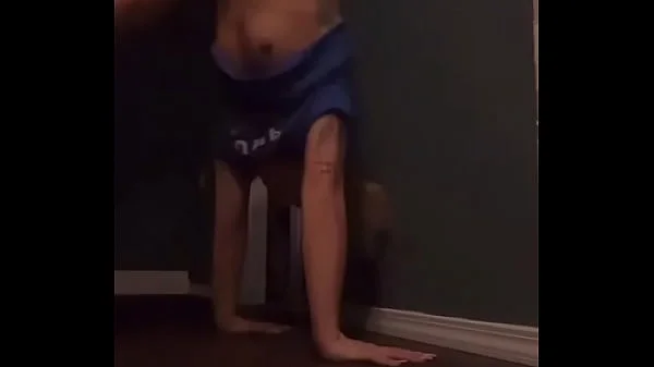 Teen doing a handstand with nip slip videos