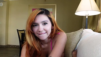 Redhead latina Cherry Gwendolyn shows off big natural tits in bikini videos