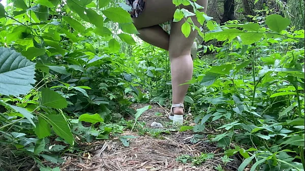MILF peeing outdoors and wiping her dirty pussy with her panties videos
