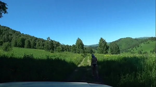 Voyeur from the car watching the juicy PAWG in panties. Amateur fetish with spying on a slender milf in a swimsuit outdoors on a public road. videos