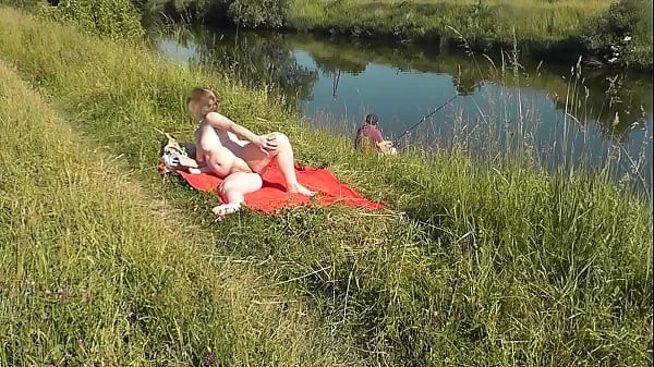 MILF sexy Frina on river bank undressed and sunbathes naked. Random man fisherman watching for her, and in the end decided to join naked woman. Wild beach. Nudist beach. Public nudity. Public exposure. Naked in public videos