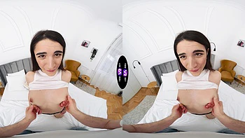 A hot brunette girl is having fun on the bed in vr videos